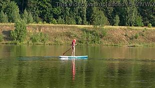 Tall skinny girl flashes her small tits in pink micro bikini at the beach