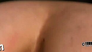 Caged cutie strips in bondage