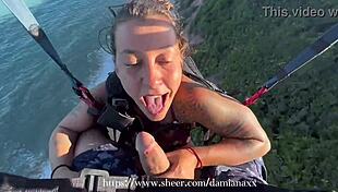 Brazilian babe flashes tits and ass naked, then gives blowjob to big cock in mid-air paragliding accident with unexpected fetish ending.