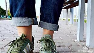 Tan nylon soles in blue jeans teasing on the bench
