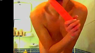 tattooed model plays with glass dildo in webcam solo masturbation