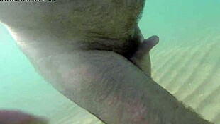 Uncle relaxes naked on the sunny beach