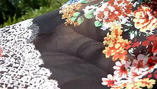 hairy mature woman flashes her chubby body in a see-through dress outdoors