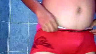 Mexican model dances seductively in satin lingerie and pantyhose