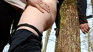 Slave in forest bondage and submission
