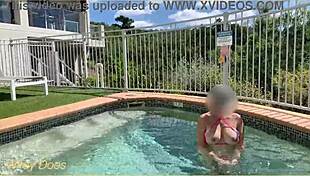 hey, check this out - my wife flashing her big tits right in the hotel pool, totally daring!
