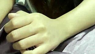 this cute asian girl surprises her boyfriend with a slow teasing handjob in their cozy bedroom