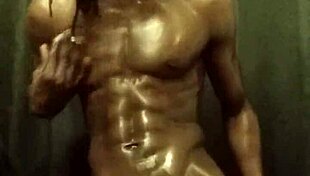 Have you seen this muscular bodybuilder stroking his big black cock with oil?