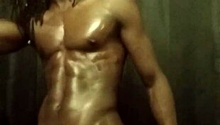 Have you seen this muscular bodybuilder stroking his big black cock with oil?