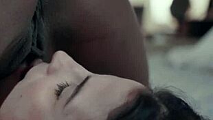 Two hot babes, a brunette and an ebony, engage in 69 position. They lick each other's pussies passionately