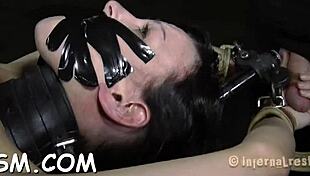 stuffing brunette with hard toy in bdsm session