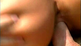 a mature man fucks an exotic babe in a cap and sunglasses on the seaside stones