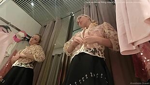 Amazing girl with big boobs changing clothes in fitting room