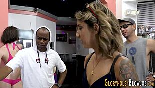 ebony babe sucking big cock at gloryhole with facial