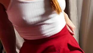 Young redhead in short skirt and stockings filmed on mobile 4k