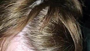 Milf rides foot while sucking huge cock, teasing the viewer with her actions