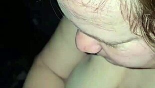 Milf rides foot while sucking huge cock, teasing the viewer with her actions