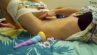 she wets herself while masturbating with dildo in bedroom