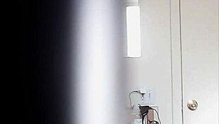 Blonde woman with big boobs is changing her clothes