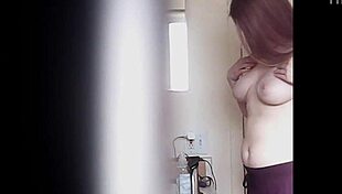 Blonde woman with big boobs is changing her clothes