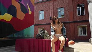 She flashes her shaved pussy on the street in public for all to see