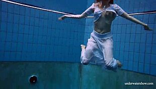 redhead marketa in a white dress in the pool