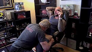 Jason Collins, the muscular biker, enjoys a blowjob while smoking a cigar.