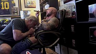 Jason Collins, the muscular biker, enjoys a blowjob while smoking a cigar.