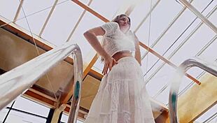 redhead marketa in a white dress in the pool