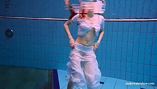 redhead marketa in a white dress in the pool