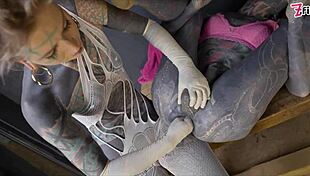 Tranny gets anal stretched by tattooed dominatrix in ass fisting