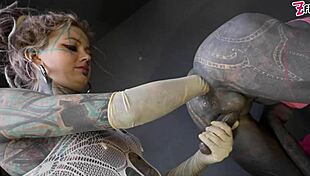 Tranny gets anal stretched by tattooed dominatrix in ass fisting