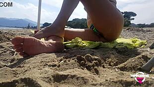 kinky mother flashing pierced pussy and nipples at public beach