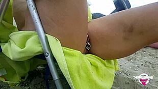 kinky mother flashing pierced pussy and nipples at public beach