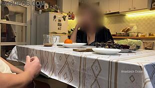 In the kitchen, my husband jerks under the table in front of my step mom and me