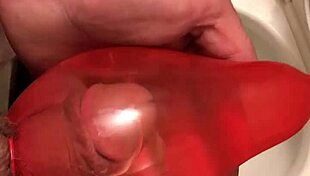 In this condom piss series part two, he fills the rubber with his urine.