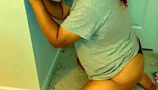 Transsexual On Knees Sucking Big Black Dildo