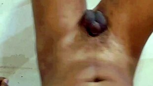 Sissy Slave Indulges in Piss Play on Body