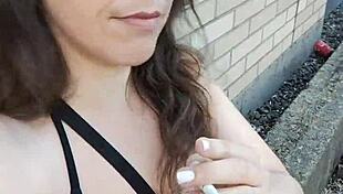 kelly kendricks smokes in the sun, showing lots of cleavage 😎