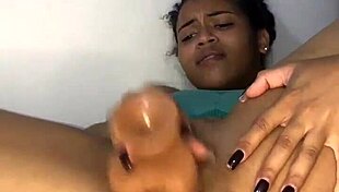 I am this young latina babe with big natural tits, pleasuring myself solo with a dildo