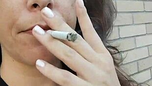 kelly kendricks smokes in the sun, showing lots of cleavage 😎