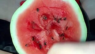 I can't believe how many orgasms she gets from that watermelon in her tight pussy!