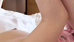 Pink micro mini one piece worn by cute asian brunette college student in teacher-student fetish scene with feet and legs focus