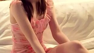 Pink micro mini one piece worn by cute asian brunette college student in teacher-student fetish scene with feet and legs focus