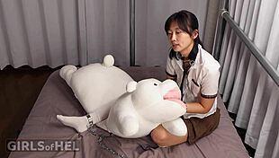 Chained up cutie makes herself cum with toys