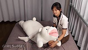 Chained up cutie makes herself cum with toys