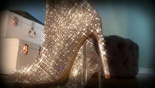 mesmerizing her slave with sparkling boots in femdom domination