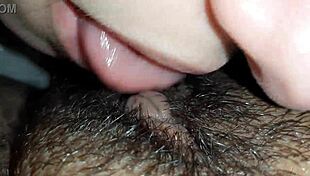 The brunette lesbian dives deep into her lover's hairy wet pussy up close
