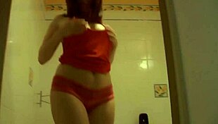 She shaves her smooth pussy then fingers it wildly in the bathroom