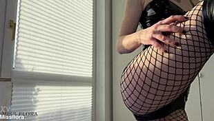 dominant babe worships her own latex-clad ass in fishnets and boots teasing softcore femdom style